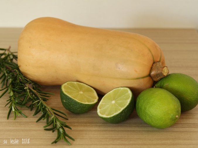 Close up shot of whole butternut squash, whole and halved limes, and rosemary sprigs. Image: Su Leslie, 2018