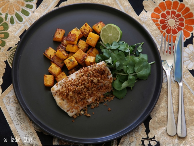 The addition of watercress and a squeeze of lime helped balance the sweetness of the squash.Overhead view of plate with pan-fried tarakihi fillet with rosemary lime crumb, roasted butternut squash and watercress. Su Leslie, 2018